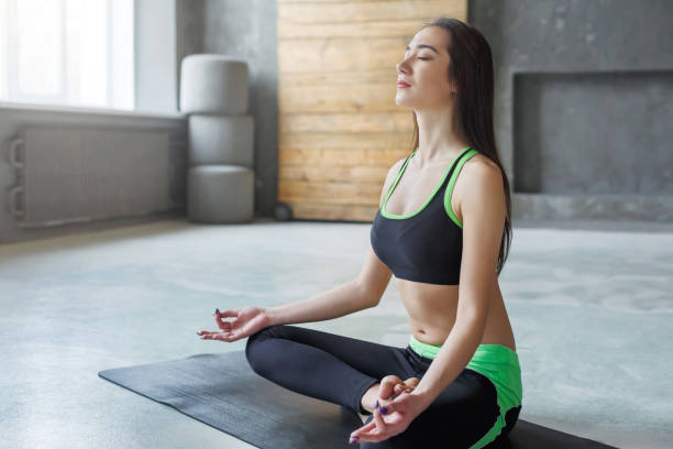 istock Young woman in yoga class, relax meditation pose 857314524