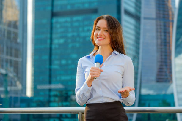 istock Young girl TV reporter is broadcasting 857314626