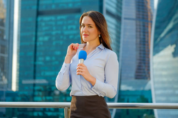 istock Young girl TV reporter is broadcasting 857314872