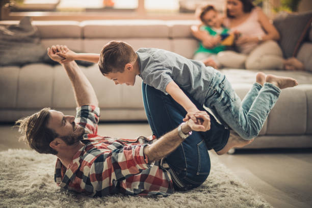 istock Playful father and son having fun while spending time at home. 857317094