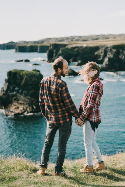 istock Couple   walking on the beach in Iceland 857317600