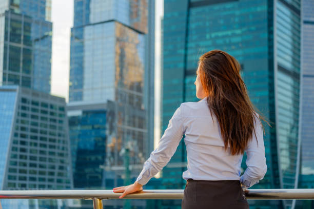 istock Young business woman back view 857317622