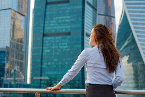 istock Young business woman back view 857317910