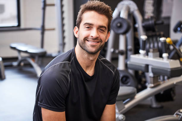 istock Smiling dude in gym 857319196