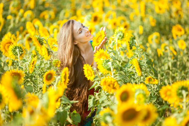 istock Happy woman on a flower field. 857323728