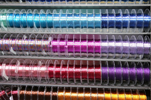 Colored ribbon in coils for sale in wholesale stocking
