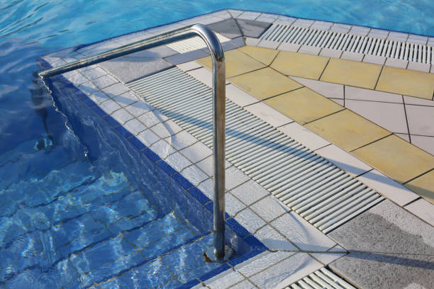 istock steel handrail to access the pool at a spa 857326928