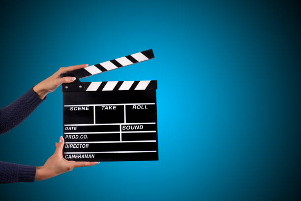 istock Clapperboard sign hold by female hands 857327532