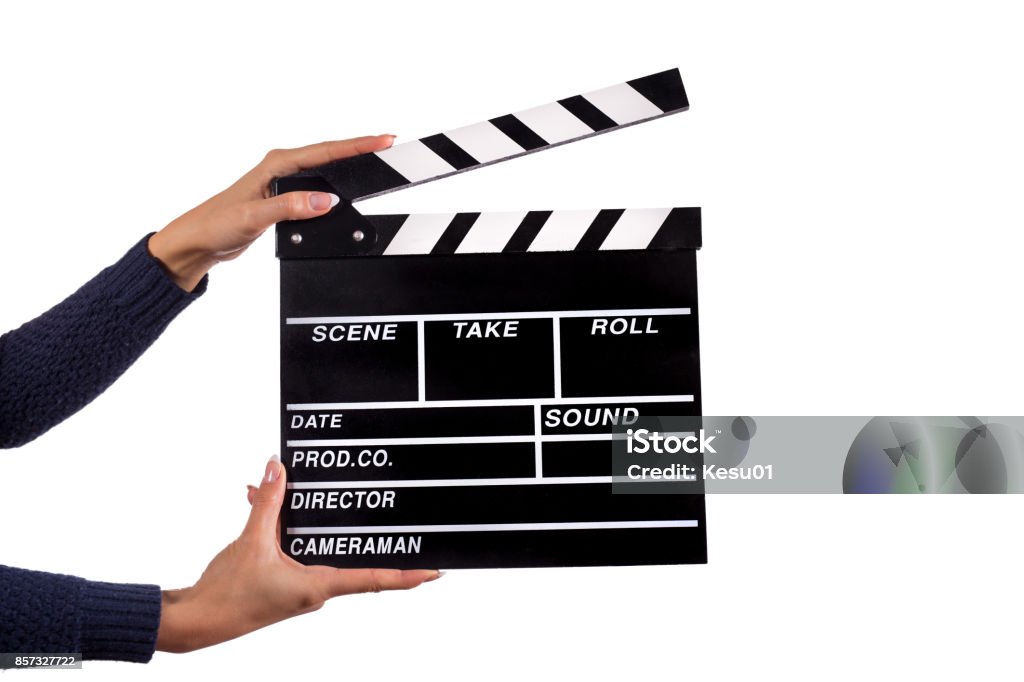 Clapperboard sign hold by female hands Clapperboard sign hold by female hands, close-up. Movie Stock Photo