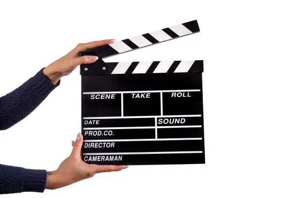 Photo of Clapperboard sign hold by female hands