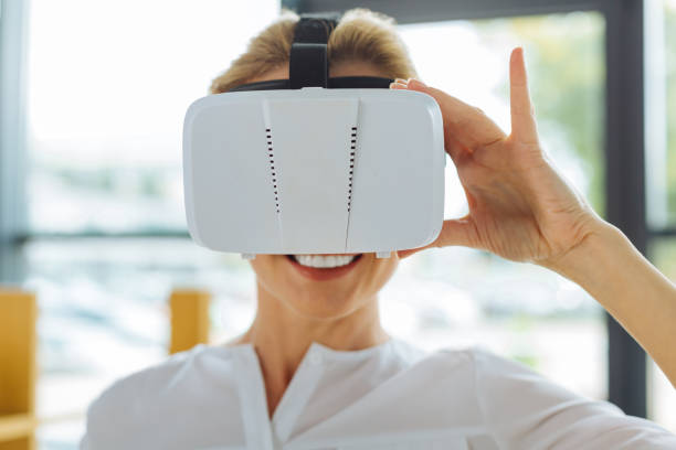 istock 3D glasses being worn by a nice cheerful positive woman 857337836
