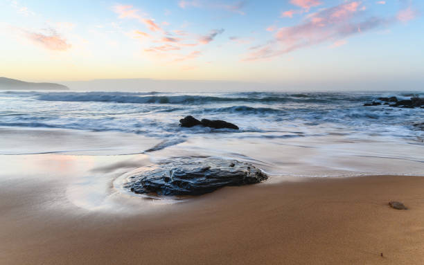 istock Dawn Seascape with Pale Pink Clouds 857338046