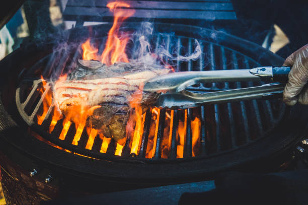 istock Tasty Beef steaks on the grill with fire flames 857340164