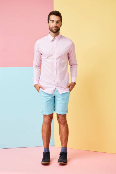 istock Pink shirt and shorts guy 857344822