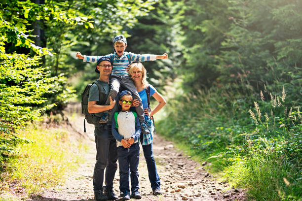 istock Happy family hiking in forest 857344992