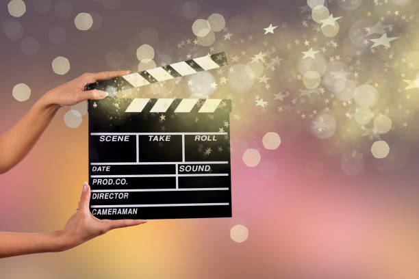 istock Clapperboard sign hold by female hands 857348054