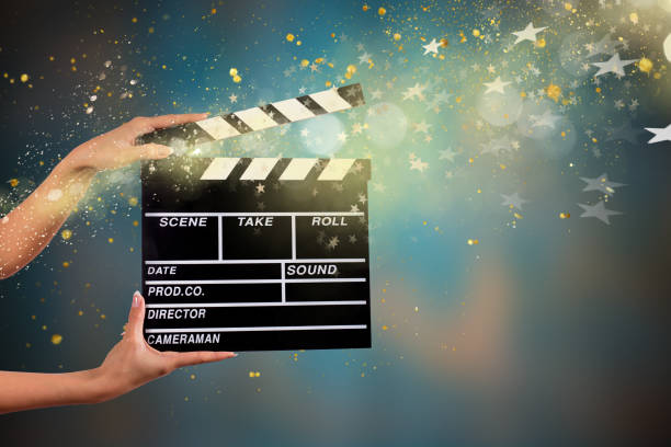 istock Clapperboard sign hold by female hands 857348108