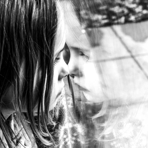 istock little girl reflected in a window 857348200
