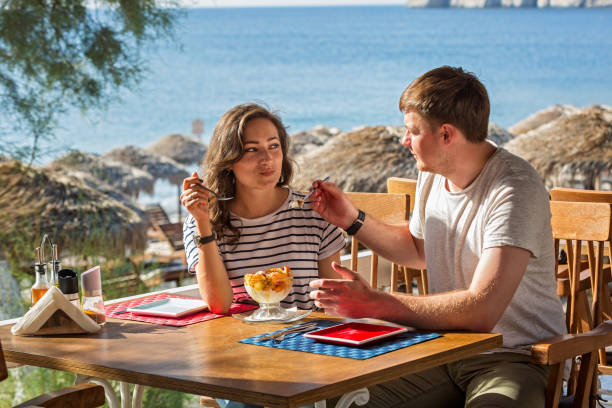 istock Young couple in beach cafe 857350892
