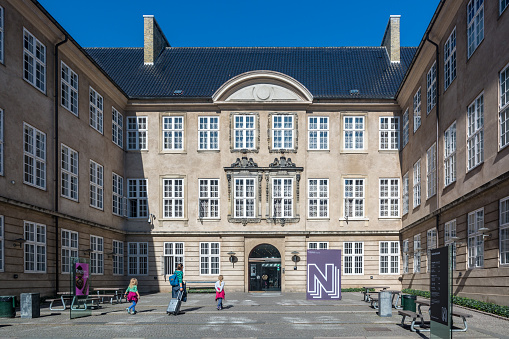 Copenhagen, Denmark - september 3, 2017: People visiting Copenhagen, near The National Museum of Denmark, Denmark's largest museum of cultural history. It contains exhibits from around the world, from Greenland to South America.