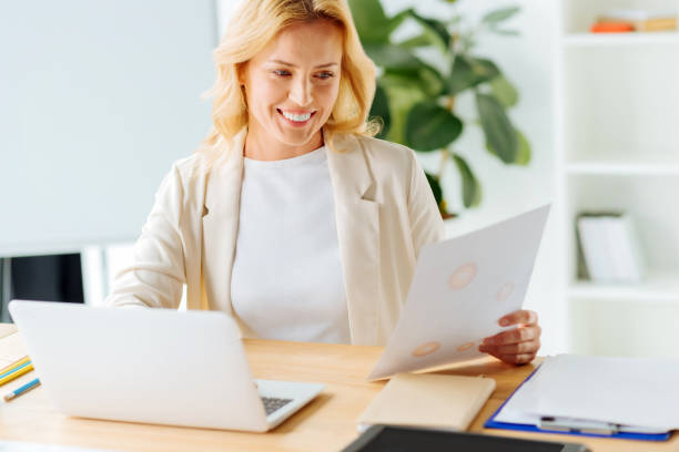 istock Smiling female person examining diagram 857364406