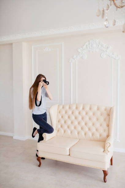 istock Woman photographer taking a shoot in a studio 857365154