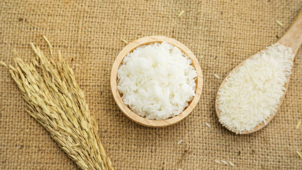 istock Jasmine rice in a bowl on a wooden table. 857368174