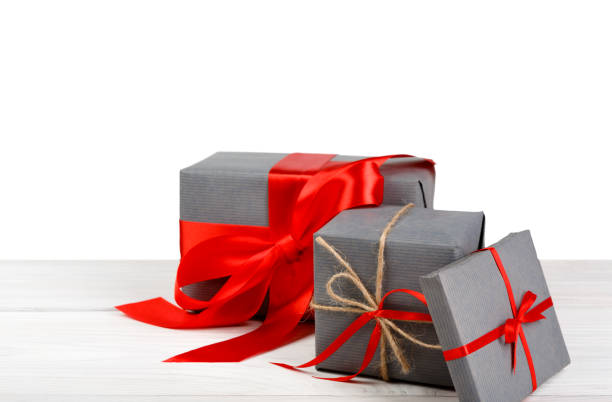 istock Christmas holiday gift boxes wrapped in paper isolated on white 857369232