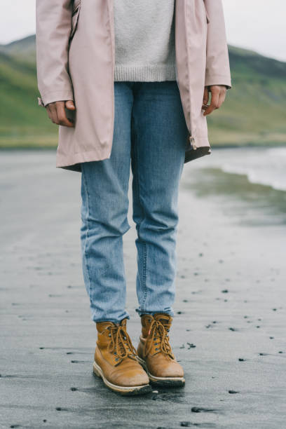 istock Woman  walking on the beach in Iceland 857370562