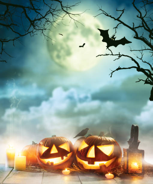 istock Spooky halloween pumpkins on wooden planks 857375788