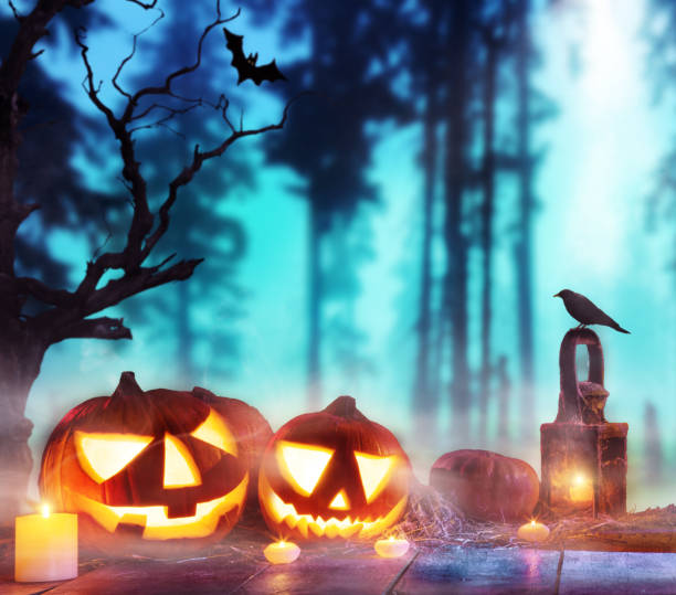 istock Spooky halloween pumpkins on wooden planks 857375832