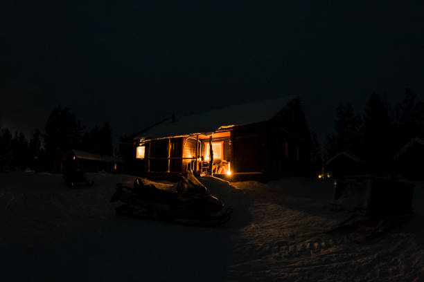 istock wooden hut in the snow at night 857376842