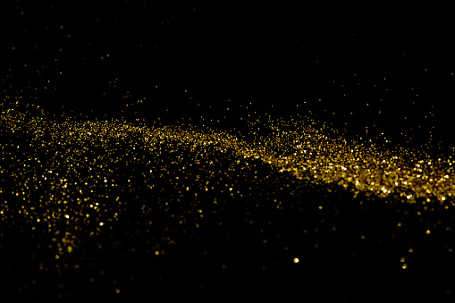 Gold glittering star light and bokeh. Magic dust abstract background element for your product.