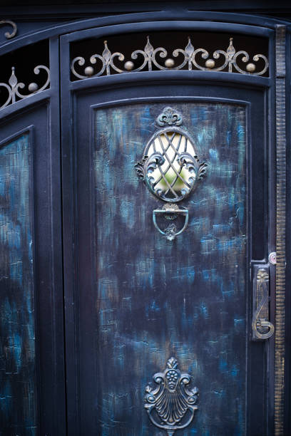 istock Details, structure and ornaments of wrought iron fence with gate 857389606
