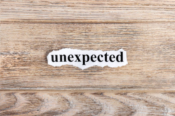istock unexpected text on paper. Word unexpected on torn paper. Concept Image 857396054
