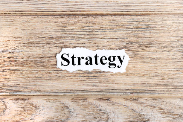 istock strategy text on paper. Word strategy on torn paper. Concept Image 857396212