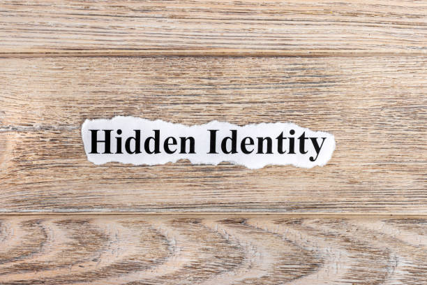 istock Hidden Identity text on paper. Word Hidden Identity on torn paper. Concept Image 857396540