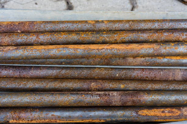 istock rusty metal pipes for construction and industrial use laying on heap 857396872