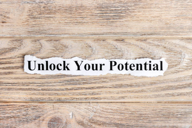 istock unlock your potential text on paper. Word unlock your potential on torn paper. Concept Image 857401750