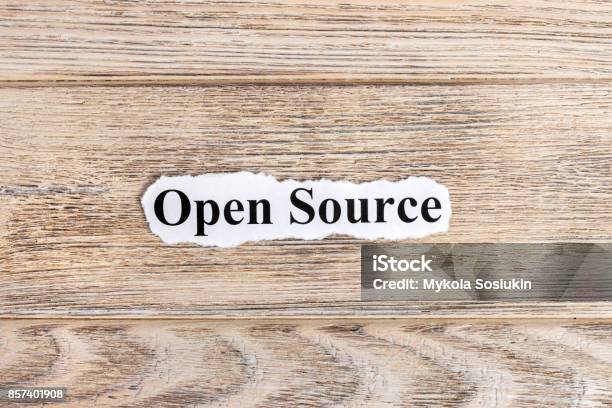 Open Source Text On Paper Word Open Source On Torn Paper Concept Image Stock Photo - Download Image Now