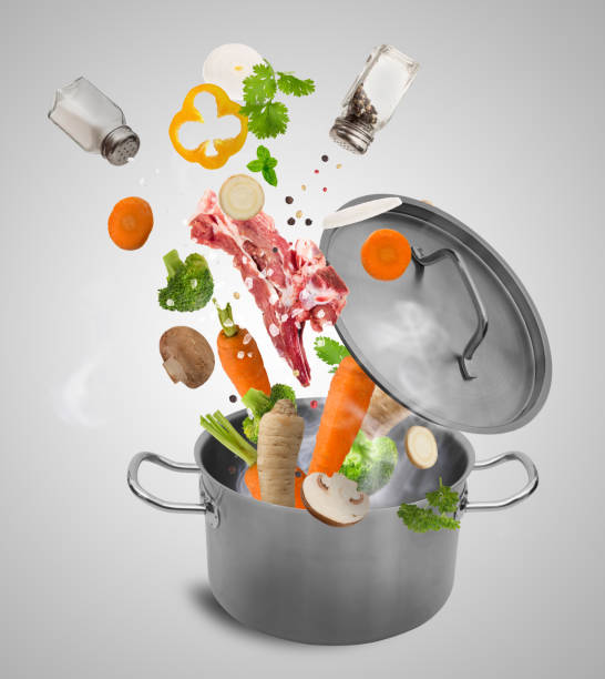 istock Fresh vegetables falling into stainless steel pot 857402326