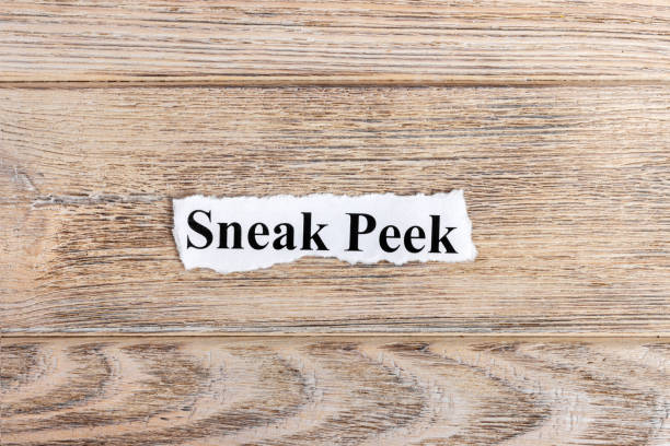 istock sneak peek text on paper. Word sneak peek on torn paper. Concept Image 857403054