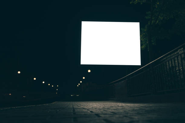 istock Blank advertising screen in the street at night 857404608
