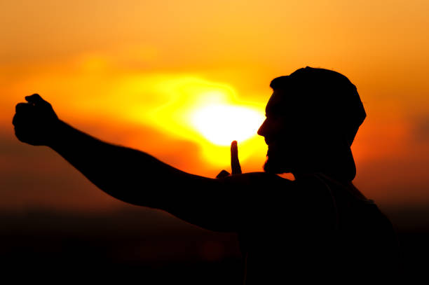 istock Silhouette of young man taking selfie picture 857406956