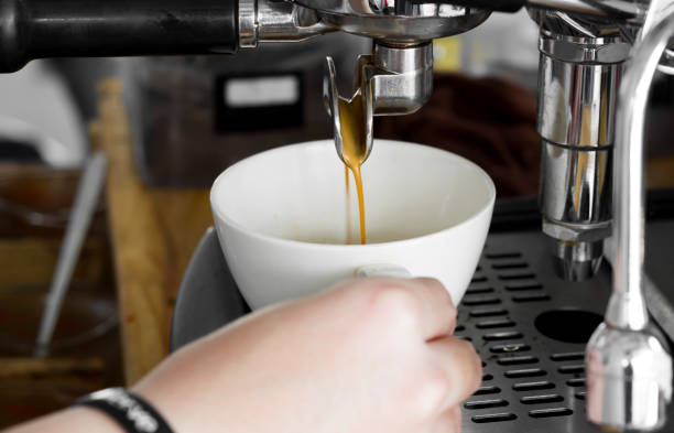 istock Professional coffee machine making espresso in a cafe, close-up 857407396