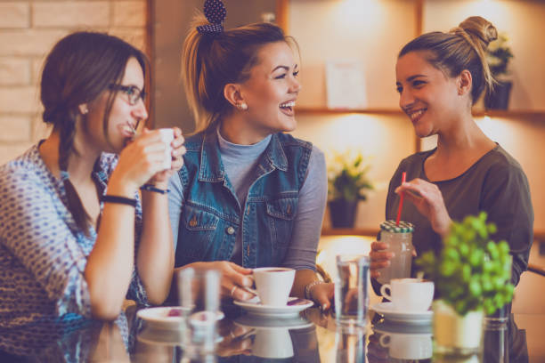 istock Female friends talking in cafe 857407430