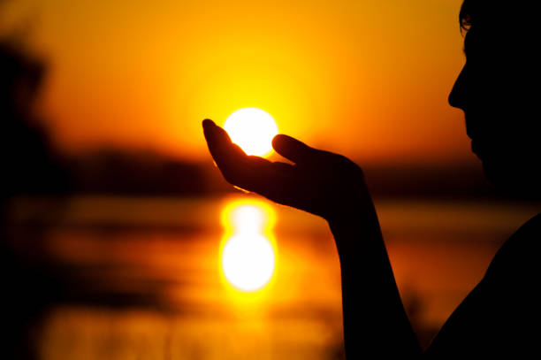 istock Silhouette of relaxed man enjoying sunset time 857407912