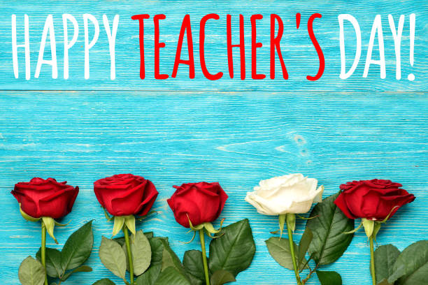 istock happy teacher's day, greeting card with red and white roses 857410752