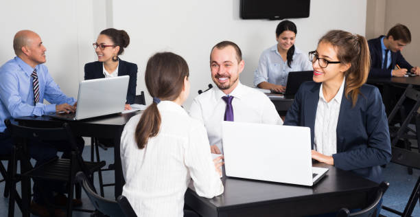 istock Smiling  employees  with laptops having a productive day 857411656