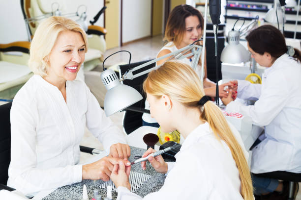 istock Women clients in nail salon 857411700